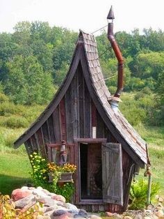 shed with tall pointy roof like a fairy tale house