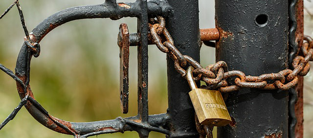 DIY Home Security Tips - padlock and chain locked gate