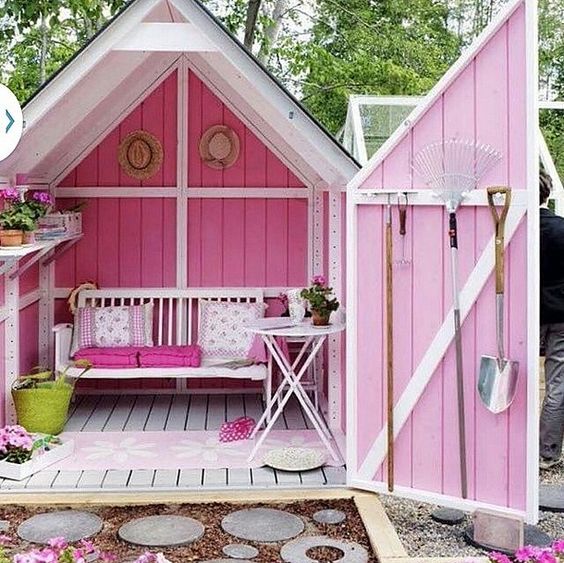 Pink she shed with table and bench