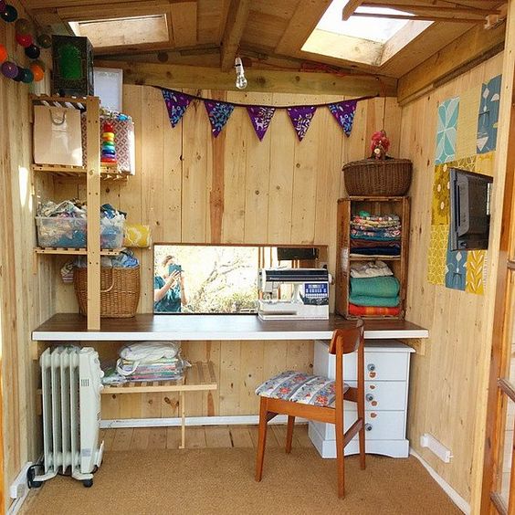 Wood pannelled She Shed set up for sewing