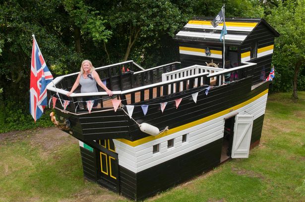 black and white shed looks like a boat